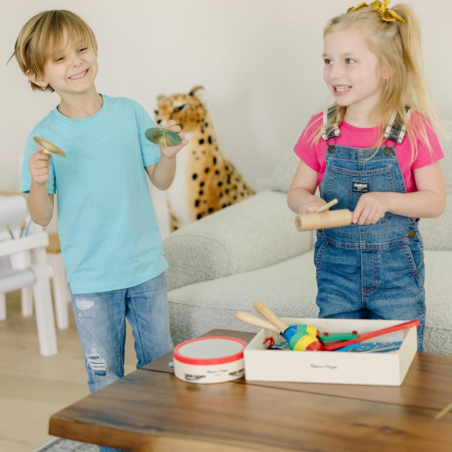 imageMelissa ampamp Doug BandinaBox Clap Clang Tap  10Piece Musical Instrument SetEnglish Only