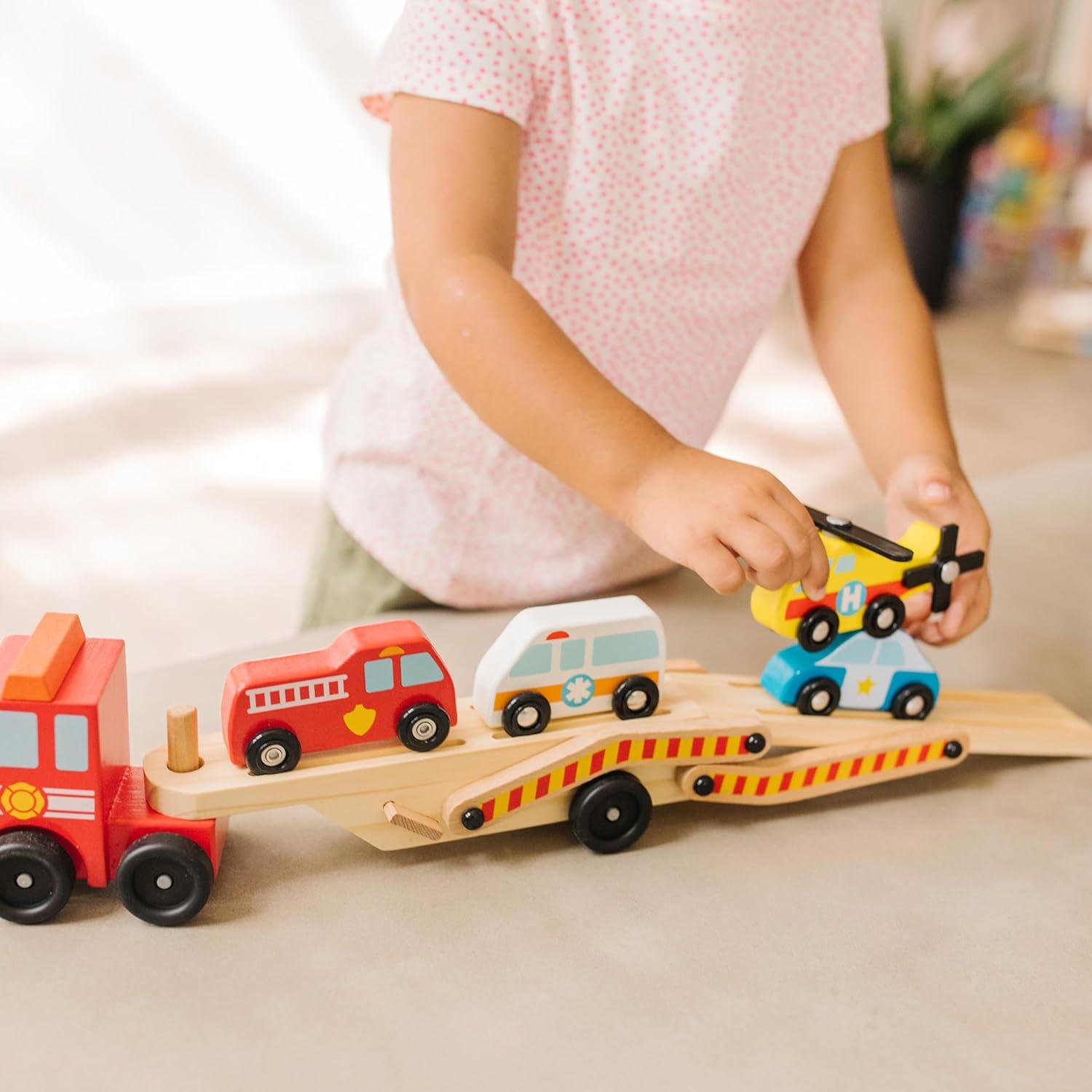 imageMelissa ampamp Doug Emergency Vehicle Carrier Wooden Truck with 4 Rescue VehiclesEnglish Only