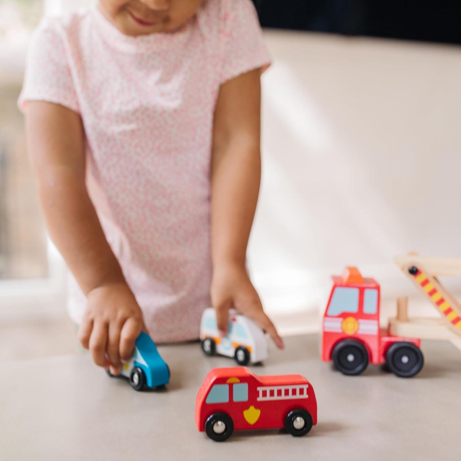 imageMelissa ampamp Doug Emergency Vehicle Carrier Wooden Truck with 4 Rescue VehiclesEnglish Only