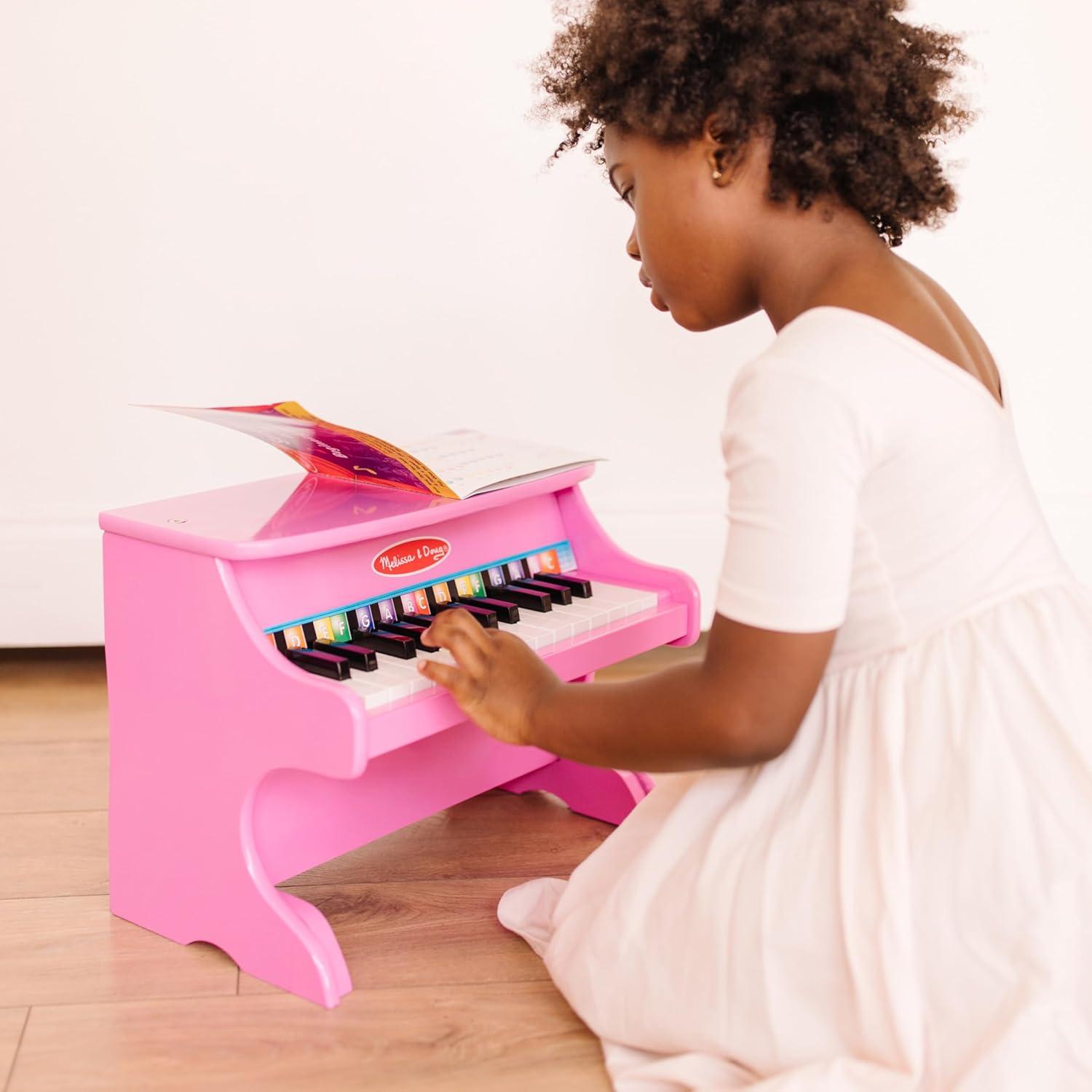 imageMelissa ampamp Doug LearntoPlay Pink Piano with 25 Keys and ColorCoded Songbook