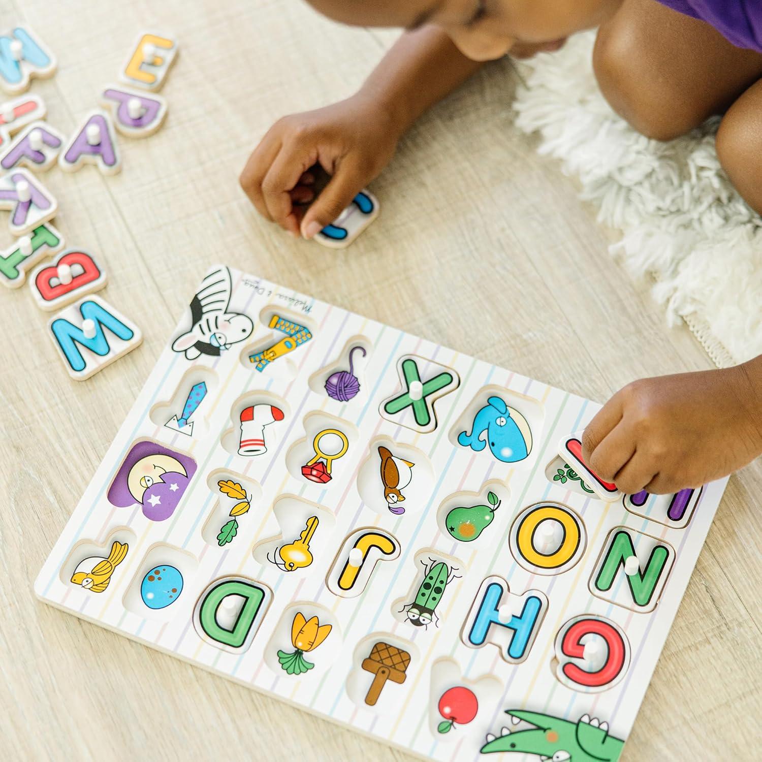 imageMelissa ampamp Doug Lift ampamp See Alphabet Wooden Peg Puzzle 26 pcs  FSC Certified
