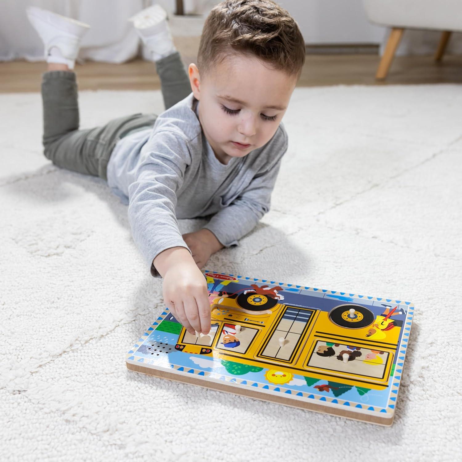 imageMelissa ampamp Doug The Wheels on The Bus Song Puzzle  8Piece Wooden Peg Puzzle with LightActivated Sounds Music Learning Toy for Toddlers and Preschoolers Ages 2