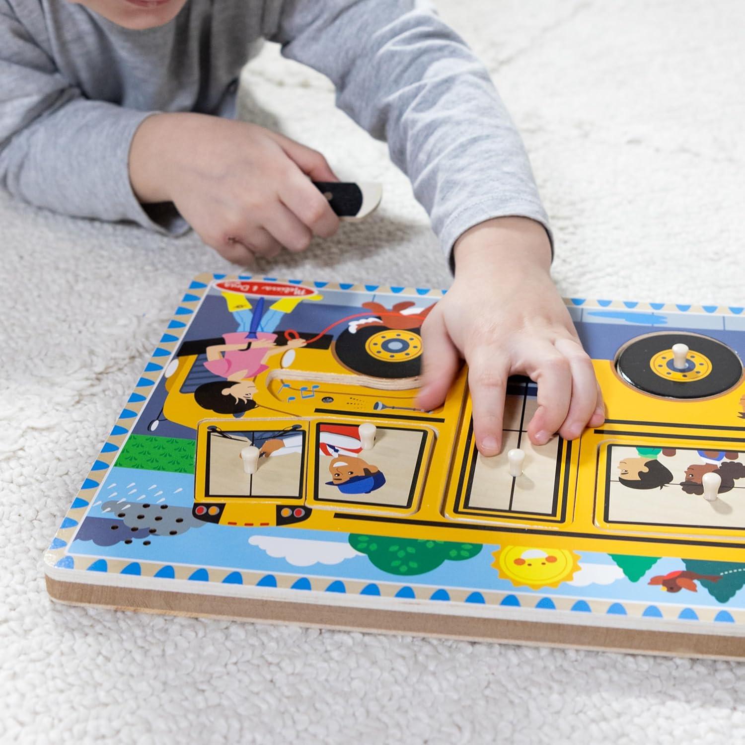 imageMelissa ampamp Doug The Wheels on The Bus Song Puzzle  8Piece Wooden Peg Puzzle with LightActivated Sounds Music Learning Toy for Toddlers and Preschoolers Ages 2